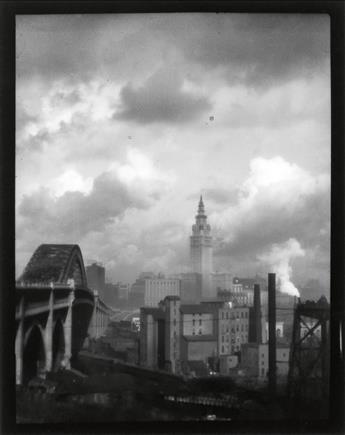 (BOURKE-WHITE, MARGARET) (1904-1971) Public Square (Terminal Tower), Seen Through a Williamson Building Grill, Cleveland, Ohio * Ter